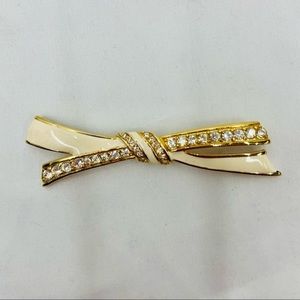Signed Givenchy Paris New York Gold tone and faux diamond ribbon bow Brooch pin